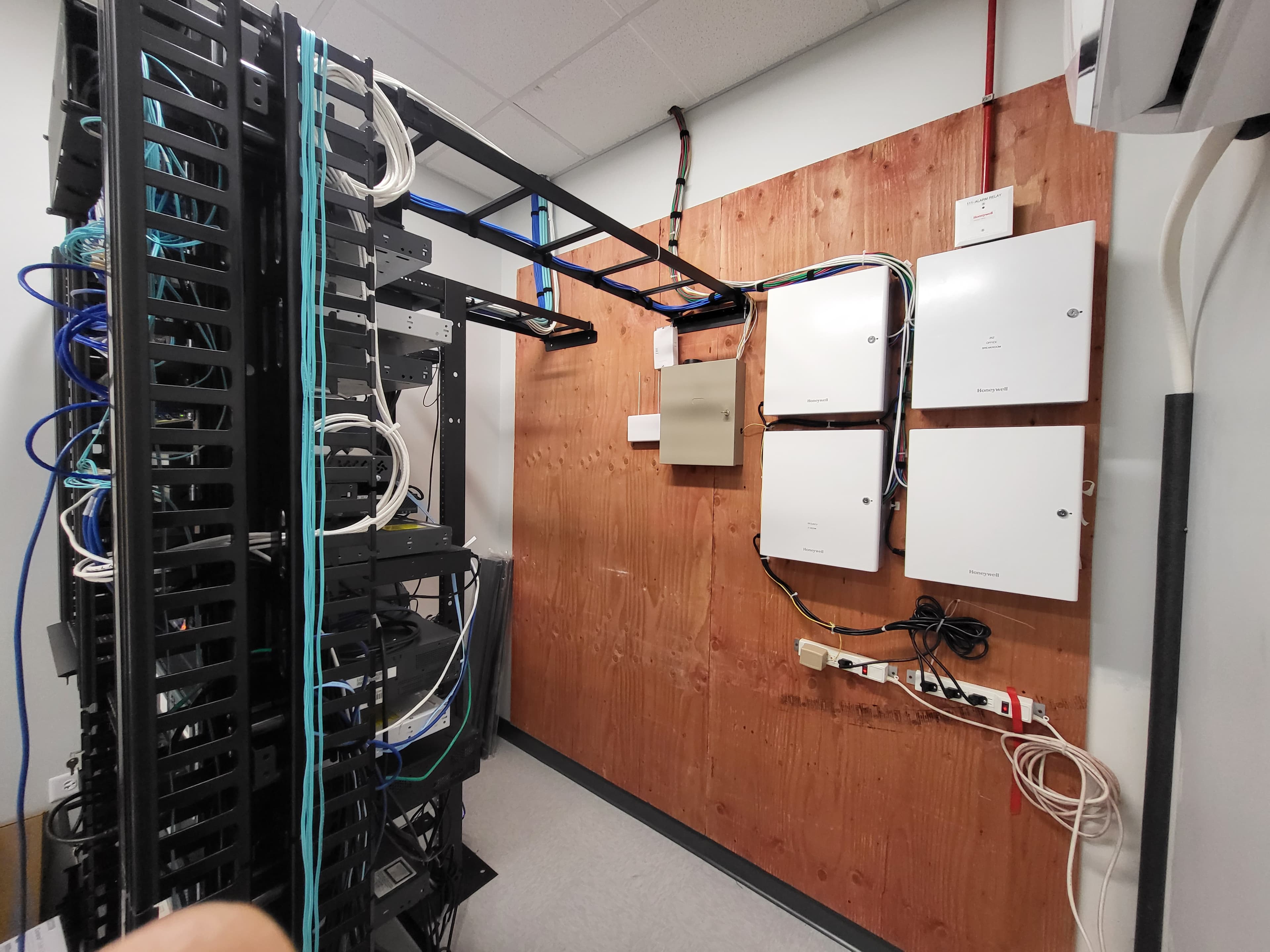 Access control and intrusion alarm panel installation in an equipment closet