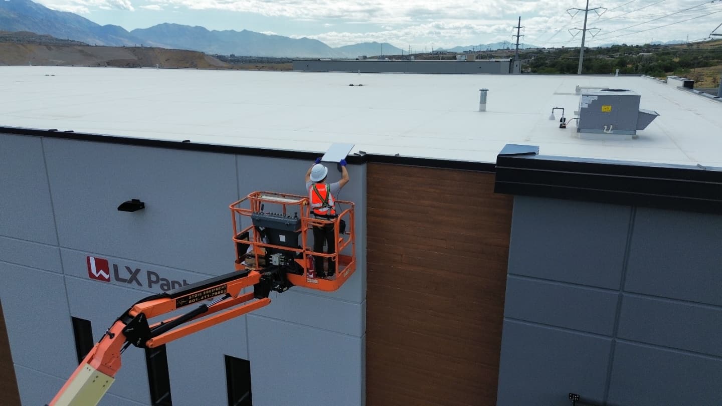Rooftop equipment install with mountain skyline in the background